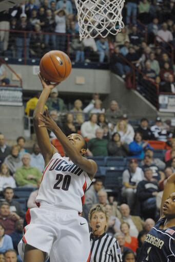 UConn guard Renee Montgomery, left, goes for a basket past Georgia Tech's Jacqua Williams during the second half of the Huskies' season-opener at Gampel Pavilion in Storrs.