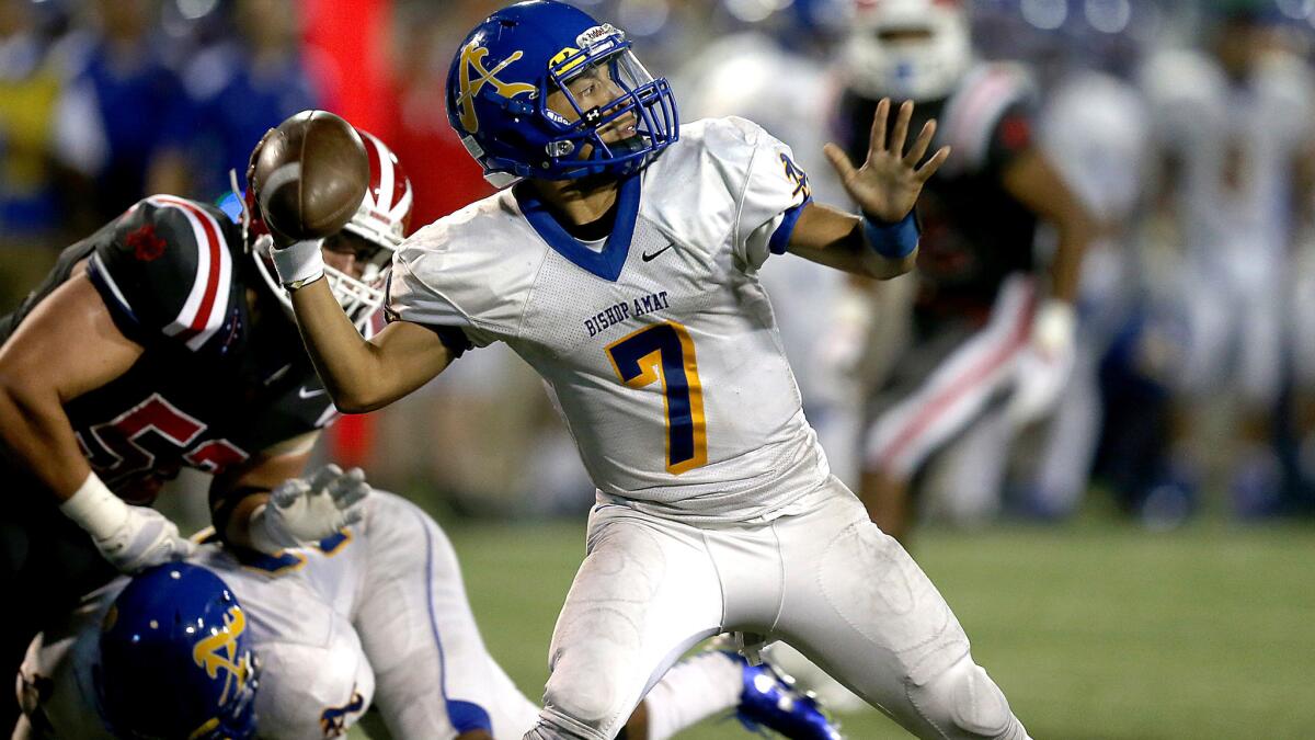 Bishop Amat quarterback Damian Garcia, shown during a game earlier this season, connected twice with Tyler Vaughns for touchdown strikes Friday night against Loyola.