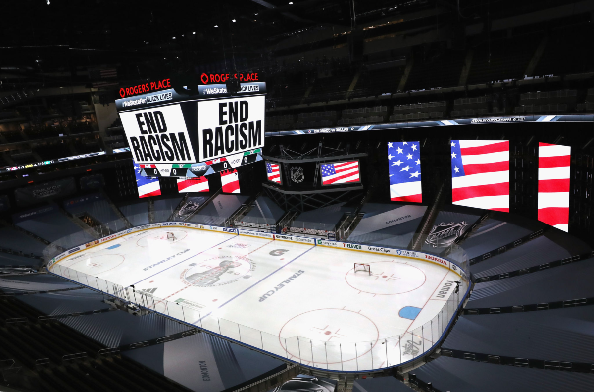 "End Racism" is displayed on the scoreboard Wednesday at Rogers Place in Edmonton, Canada.