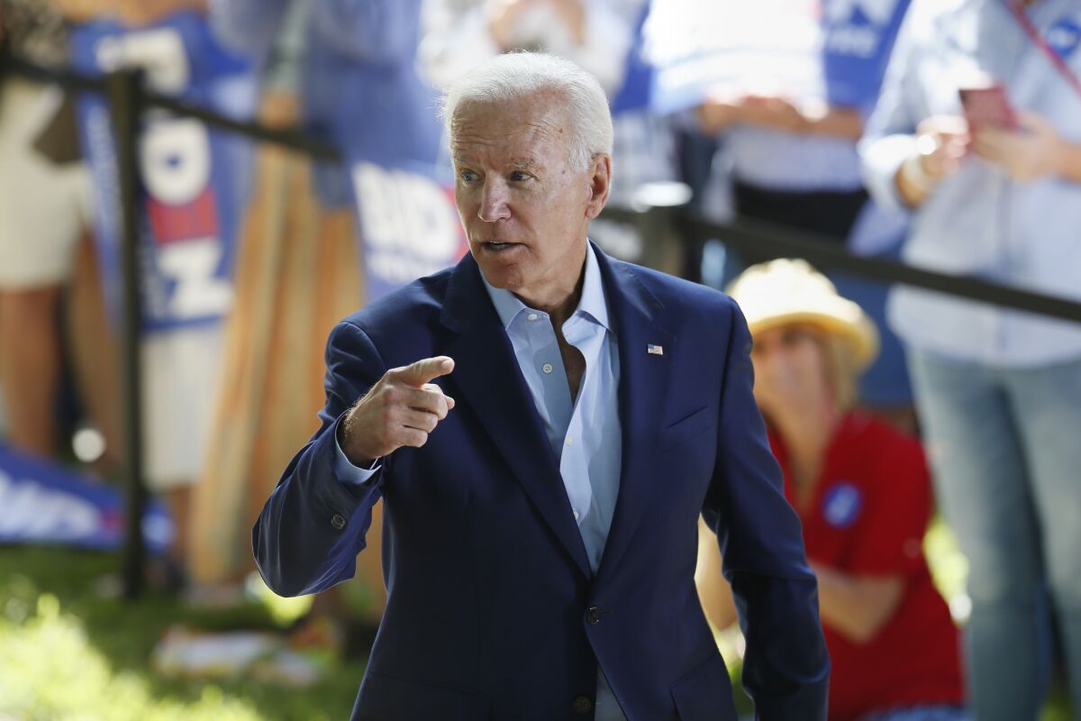 Democratic presidential candidate Joe Biden moves to greet supporters after speaking during a campaign event in New Hampshire on Aug. 24.