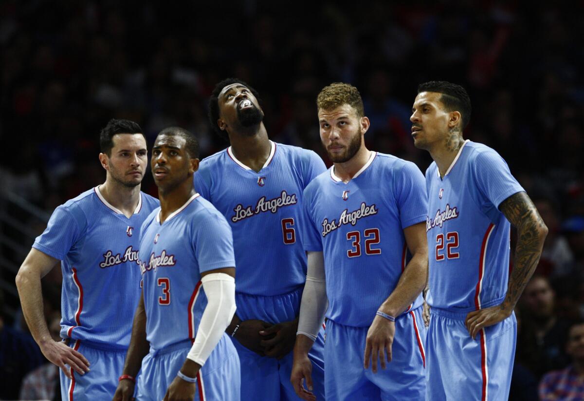 Chris Paul, second from left, and Blake Griffin, second from right, are the two unquestioned leaders of the Clippers, but they have different approaches to leading their team.