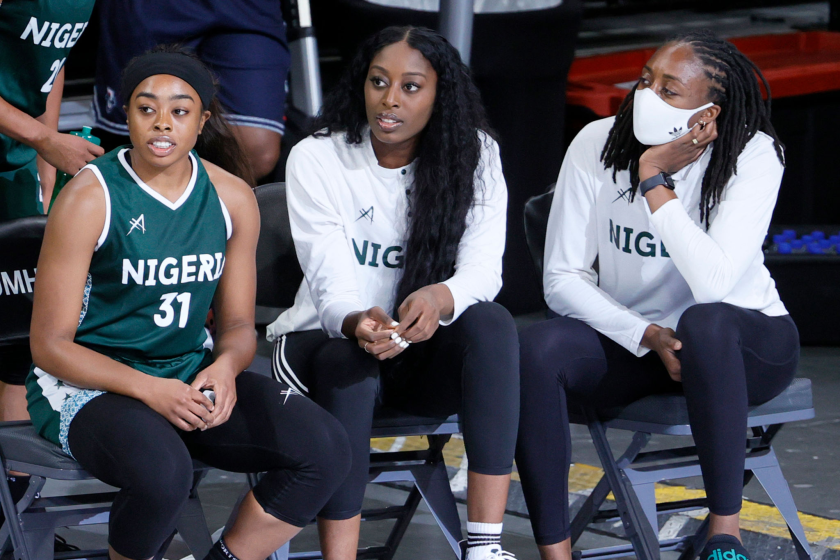 LAS VEGAS, NEVADA - JULY 18: (L-R) Erica Ogwumike #31, Chiney Ogwumike #15 and Nneka Ogwumike #30 of Nigeria look on from the bench during an exhibition game against the United States at Michelob ULTRA Arena ahead of the Tokyo Olympic Games on July 18, 2021 in Las Vegas, Nevada. The United Stated defeated Nigeria 93-62. (Photo by Ethan Miller/Getty Images)