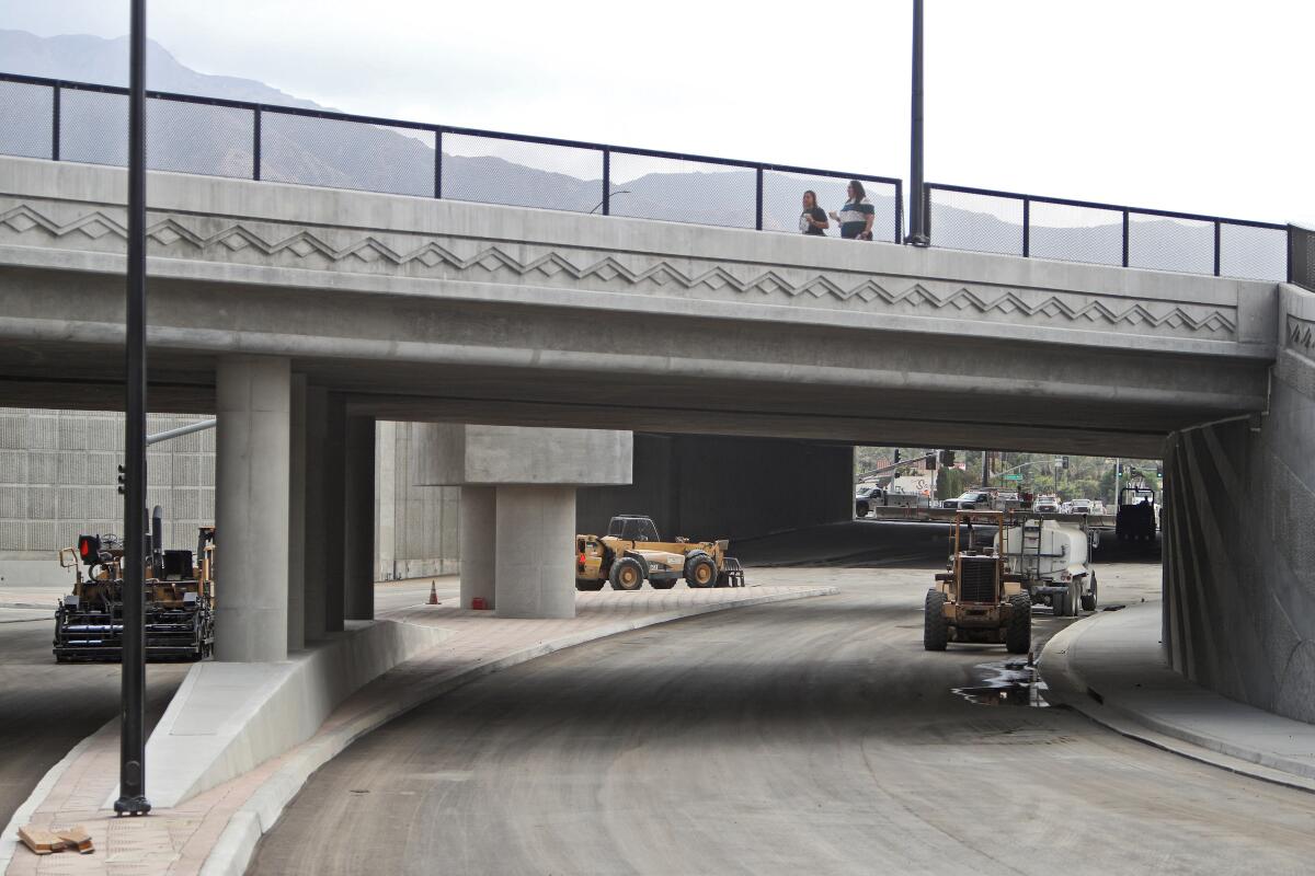 A view looking east from West Empire Avenue toward North San Fernando Boulevard, with North Victory Place and the 5 Freeway passing above, on Tuesday. The street will open toward the end of this month.