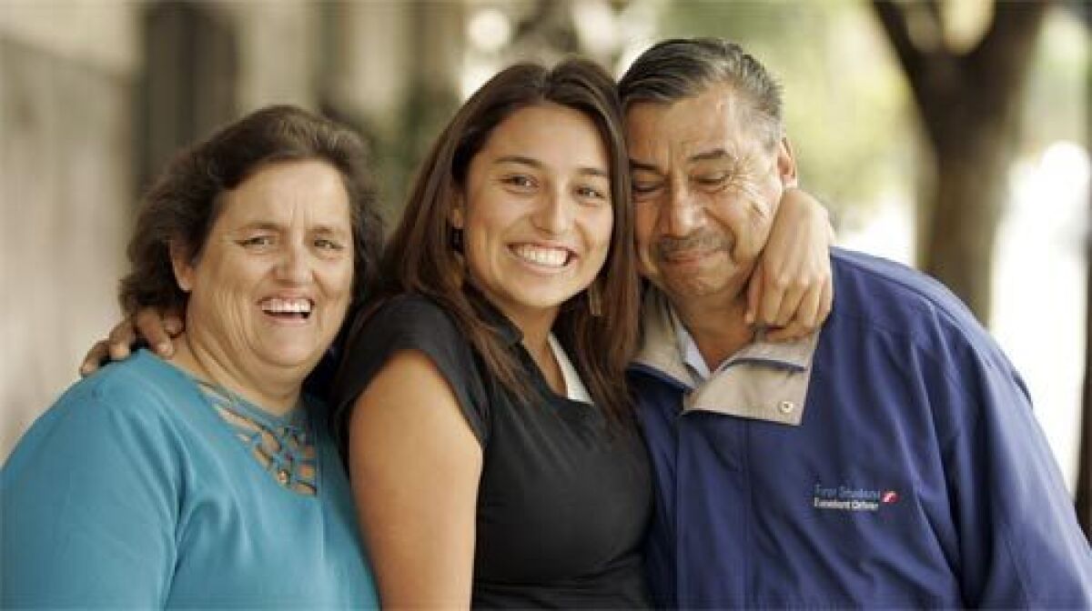 CHANGE: Damaris Pereda, who is bilingual, is flanked by her parents, Rosa and Manuel Pereda of Huntington Park.