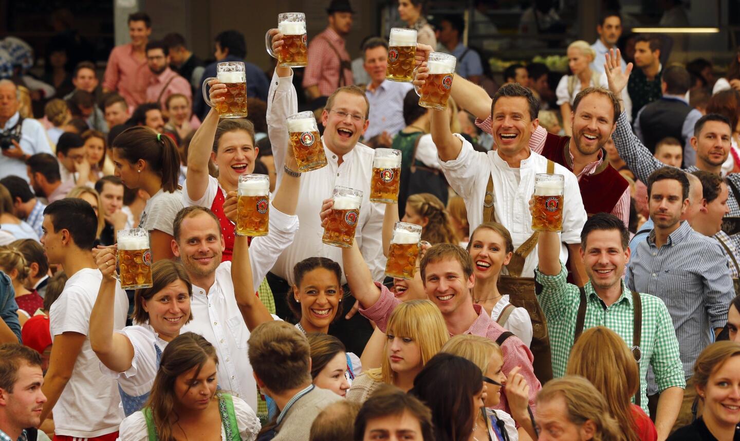 People celebrate the opening of the Oktoberfest beer festival in Munich, Germany, in 2015.