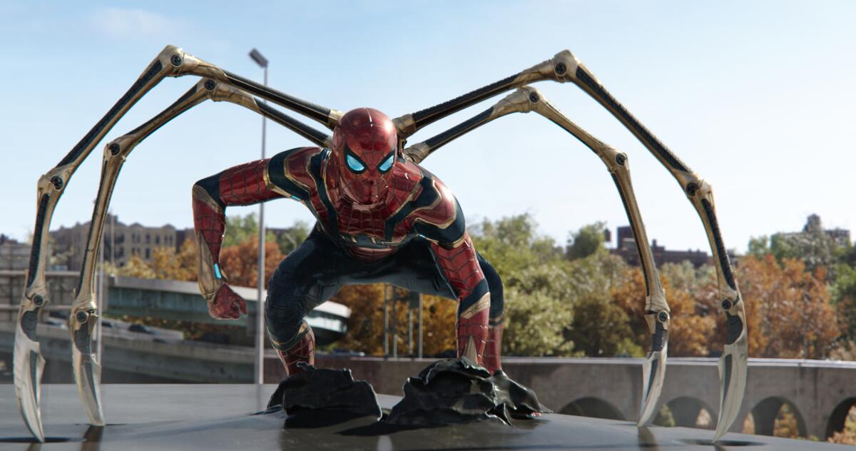 Spider-Man crouches, with metallic spider legs extended.