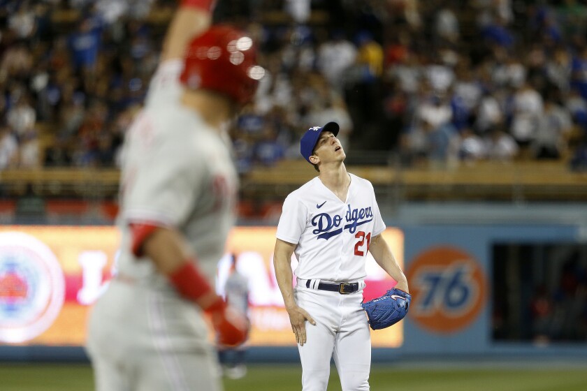 Dodgers starting pitcher Walker Buehler reacts after giving up a two-run home run.