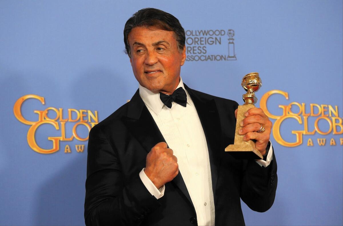 Sylvester Stallone clutches the trophy he won for “Creed,” revisiting a touchstone role.