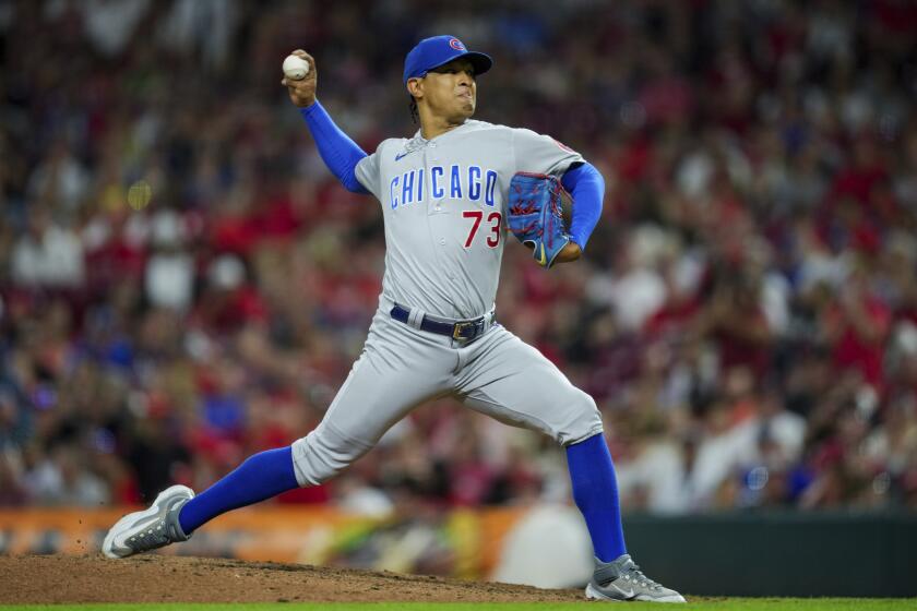 Chicago Cubs' Adbert Alzolay throws during the ninth inning of the second game of a baseball doubleheader against the Cincinnati Reds in Cincinnati, Friday, Sept. 1, 2023. (AP Photo/Aaron Doster)