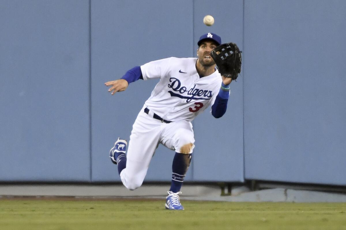 Dodgers center fielder Chris Taylor catches a fly ball.