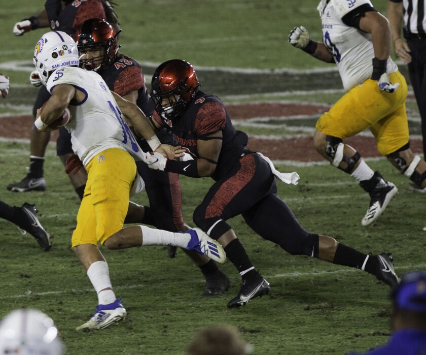San Jose State quarterback Nick Nash is chased down by San Diego State cornerback Tayler Hawkins.