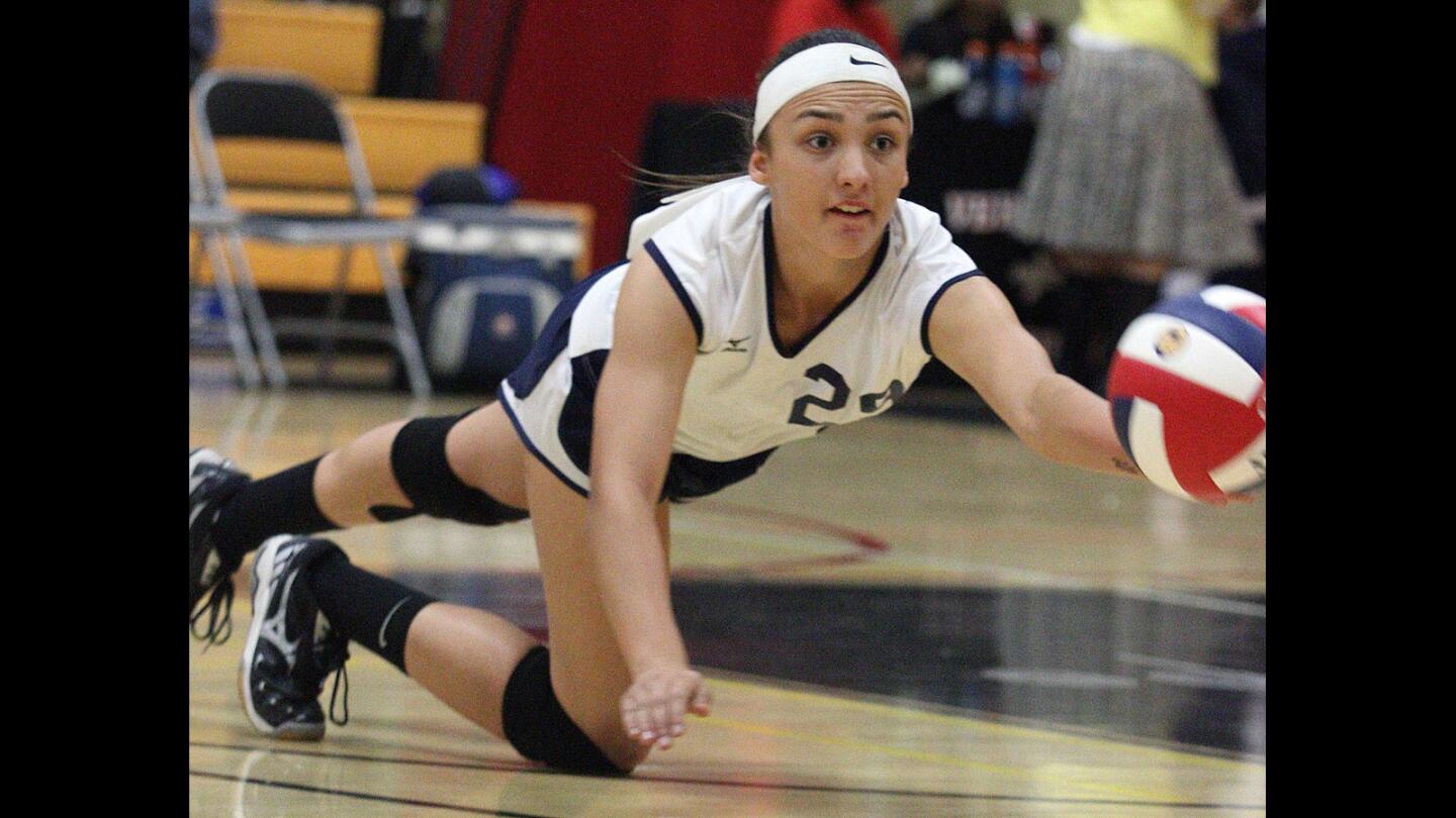 St. Monica Academy's Yamila Evans dives for the ball against Verdugo Hills in first round Division V State CIF girls volleyball at Cesar E. Chavez Learnig Academies in San Fernando on Tuesday, November 24, 2015.