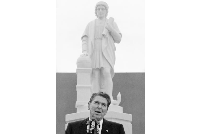 FILE - In this Monday, Oct. 9, 1984, file photo, President Ronald Reagan addresses a ceremony in Baltimore, to unveil a statue of Christopher Columbus. Baltimore protesters pulled down the statue of Christopher Columbus and threw it into the city's Inner Harbor, Saturday, July 4, 2020. (AP Photo/Lana Harris, File)