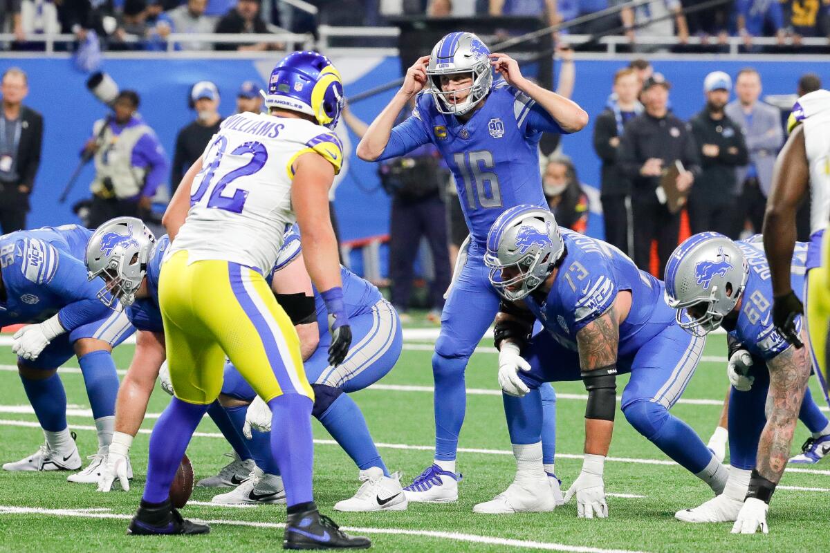Lions quarterback Jared Goff (16) signals from the line against his former team, the Rams.