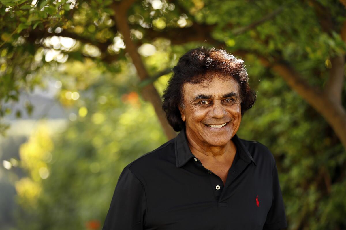 Legendary singer Johnny Mathis at his Hollywood Hills home in 2015. Mathis will perform Sunday at Segerstrom Center for the Arts during his 60th anniversary Christmas Concert Tour.