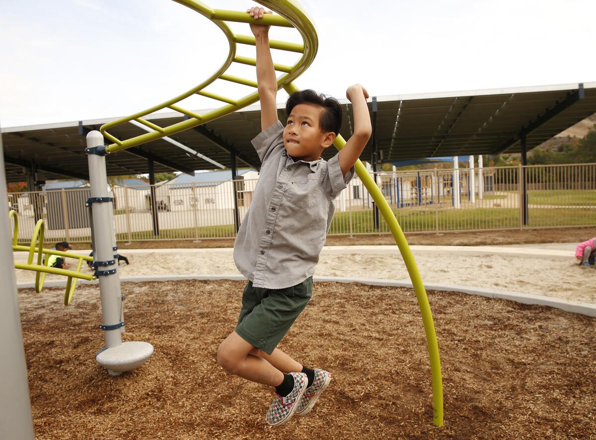 Sawyer Dinh on a playground
