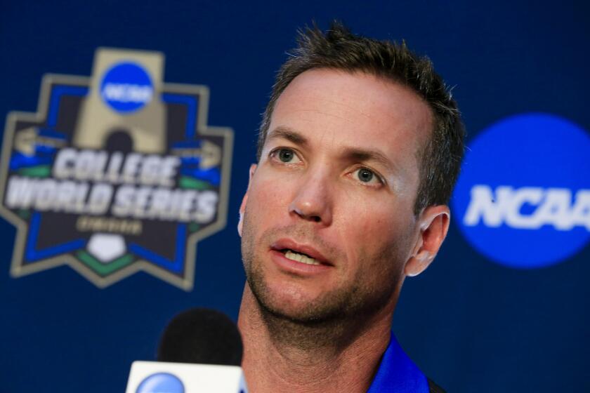 FILE - In this June 17, 2016, file photo, UC Santa Barbara NCAA college baseball coach Andrew Checketts speaks during a coaches' news conference at TD Ameritrade Park in Omaha, Neb., ahead of the College World Series. UC Santa Barbara, which had two straight losing seasons after reaching the College World Series in 2016, has won nine straight after sweeping nationally ranked UC Irvine. The Gauchos are 27-5 overall, 5-1 in the Big West and ranked in the top 10 this week.(AP Photo/Nati Harnik, File)