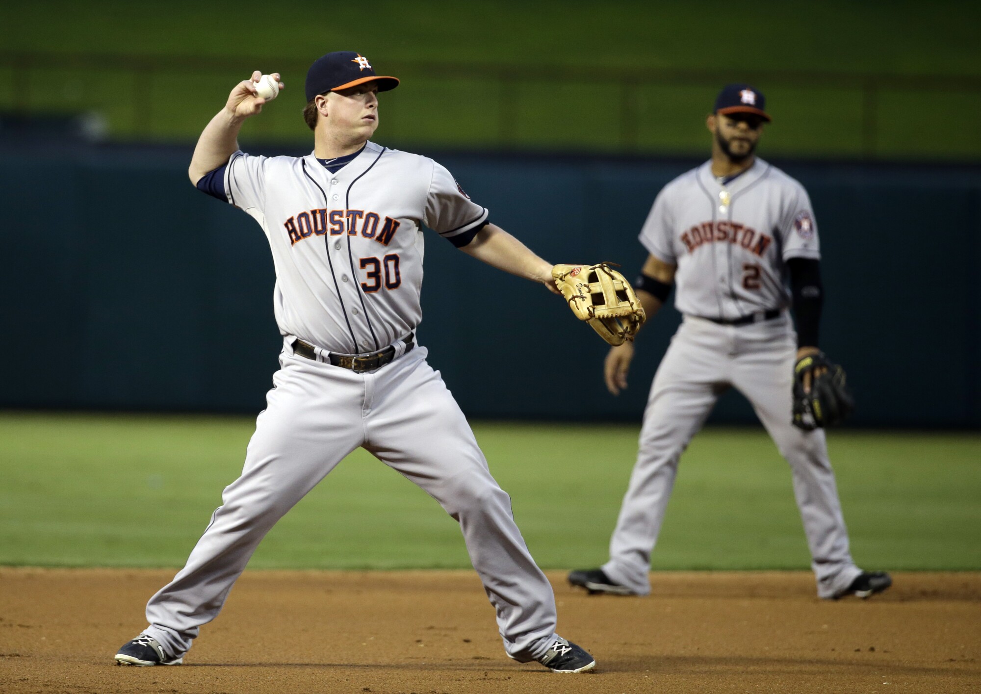 Houston Astros third baseman Matt Dominguez throws to first against the Texas Rangers in September 2014.
