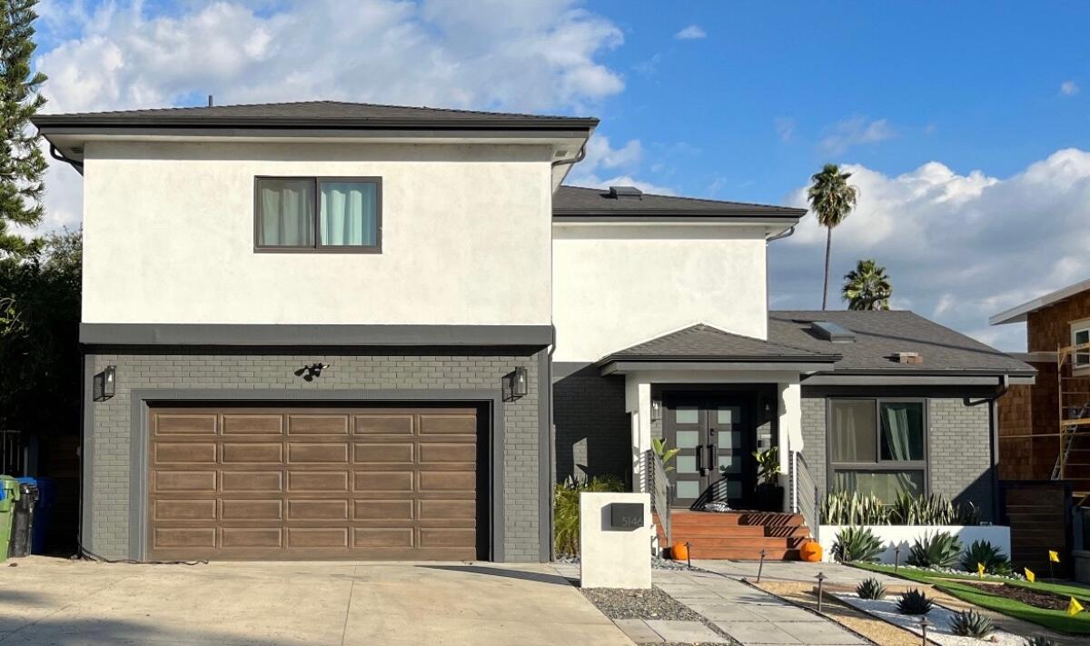 This two-story home features a black-and-white exterior.