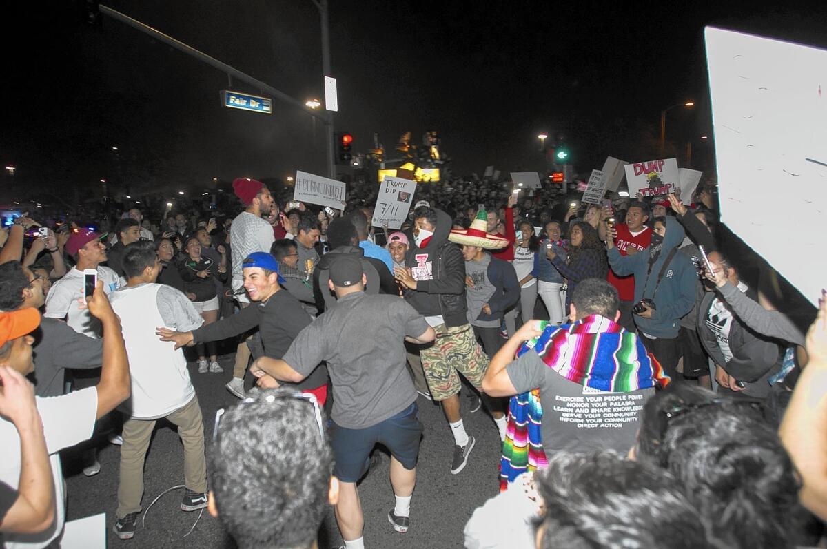 A crowd blocks the street at the corner of Fairview Road and Fair Drive in Costa Mesa following a Donald Trump rally at the Orange County fairgrounds April 28.