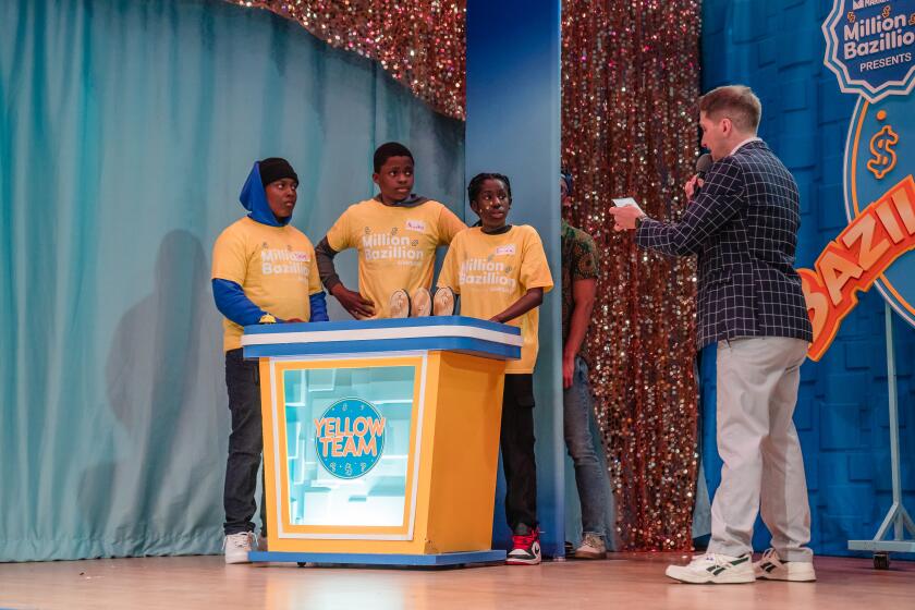 Host Kane Prestenback and Yellow team, Teanna Coaxum, Micahel Aduba, and Dexter Prospere during Million Bazillion Live at Horace Mann Middle School in Rolando on April 29, 2024. (Ariana Drehsler / For The San Diego Union-Tribune)