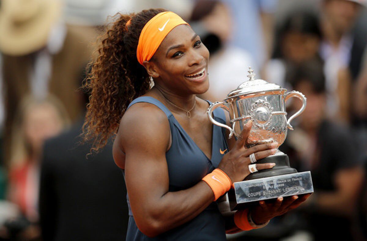 Serena Williams holds the Coupe Suzanne Lenglen after defeating Maria Sharapova, 6-4, 6-4, in the French Open women's final on Saturday at Roland Garros.