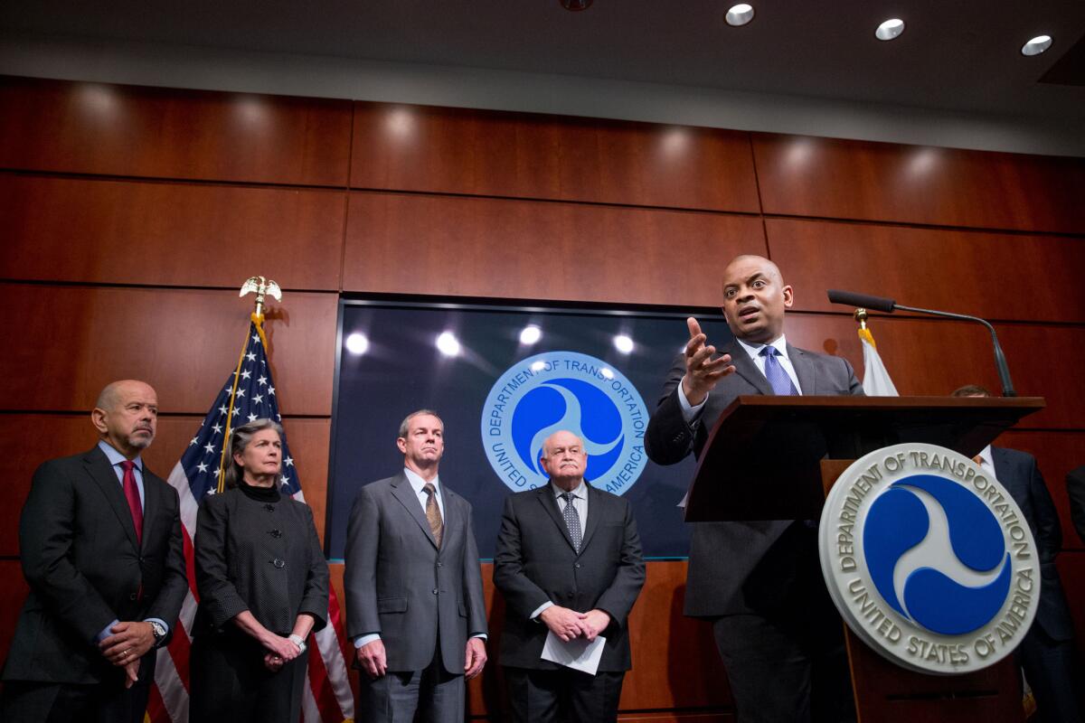 Transportation Secretary Anthony Foxx, right, accompanied by FAA Administrator Michael Huerta, left, speaks at a news conference at the Department of Transportation in Washington on Oct. 19 where he announced the creation of a task force to develop recommendations for a registration process for Unmanned Aircraft Systems (UAS).