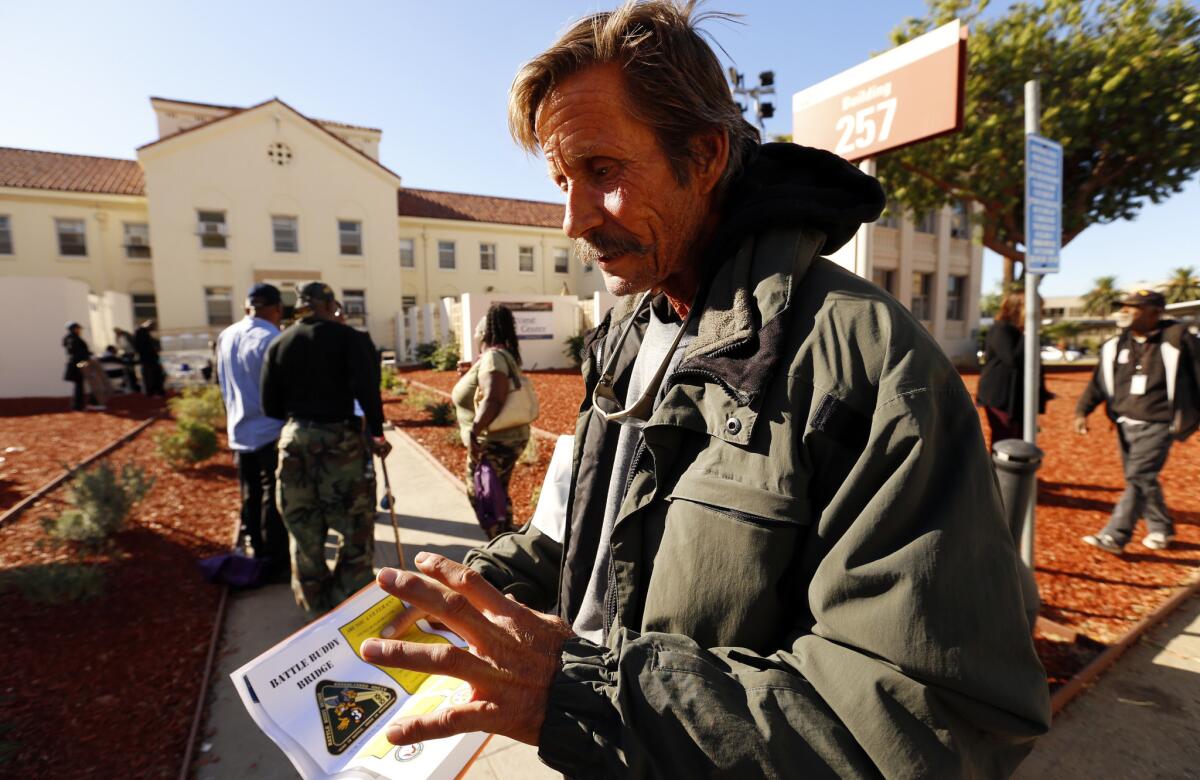 Jake Mitchell, a homeless veteran, looks for assistance while attending the stand-down at the West Los Angeles Veterans Affairs campus.