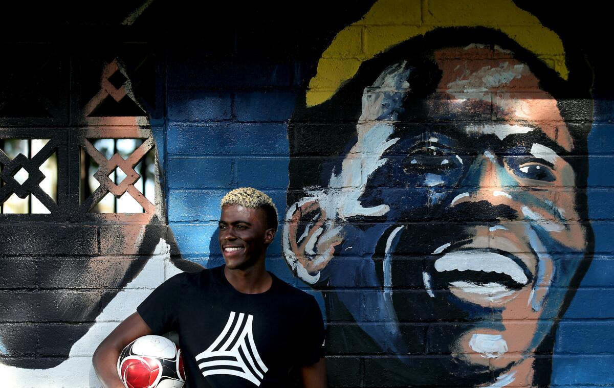 Galaxy forward Gyasi Zardes stands next to a mural of himself at Hawthorne Memorial Park. He grew up in Hawthorne and played soccer at nearby Leuzinger High in Lawndale.