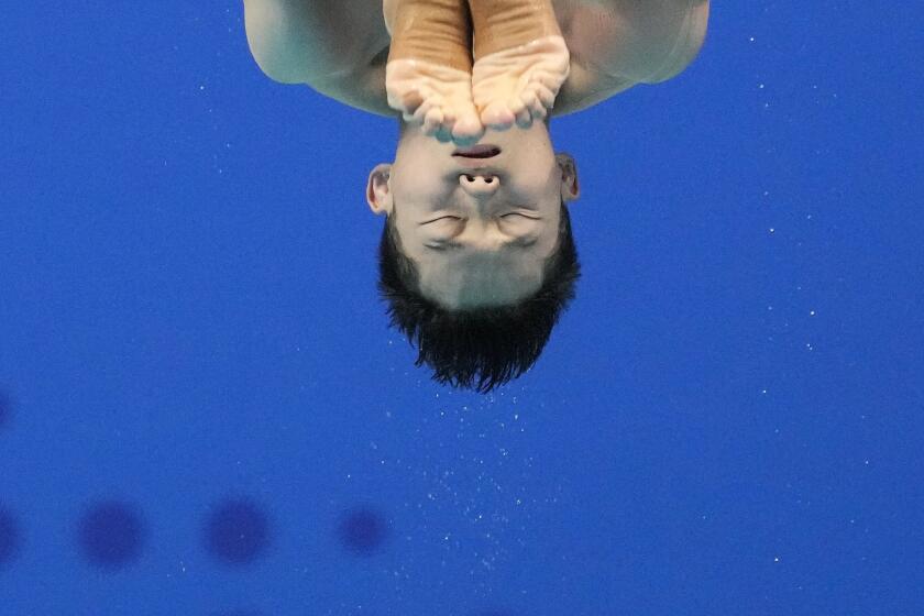 Wang Zongyuan of China performs during men's 1m Springboard diving final at the 19th Asian Games in Hangzhou, China, Jinhua, Monday, Oct. 2, 2023. (AP Photo/Aaron Favila)