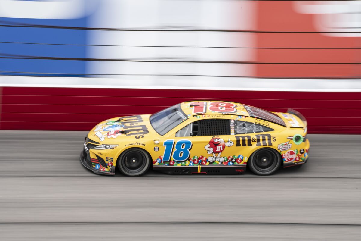 Kyle Busch (18) competes during a NASCAR Cup Series auto race at Darlington Raceway, Sunday, May 8, 2022, in Darlington, S.C. (AP Photo/Matt Kelley)