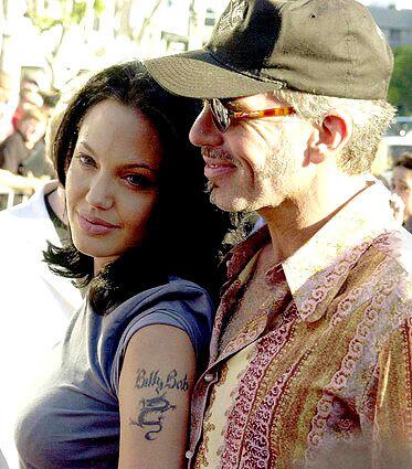 Angelina used to cut herself, she once told Barbara Walters that she has been involved with a woman, and she has numerous tattoos. (That "Billy Bob" tat seemed like a good idea at the time.)