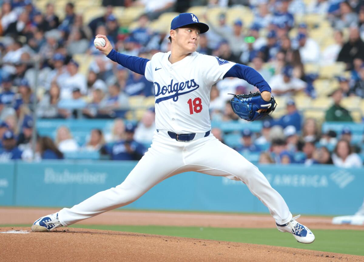 Dodgers pitcher Yoshinobu Yamamoto delivers against the Arizona Diamondbacks at Dodger Stadium in May.
