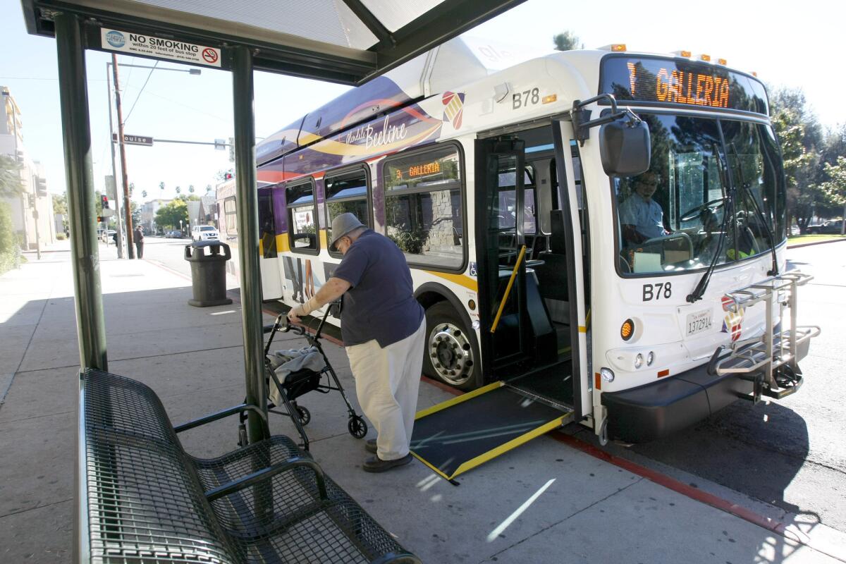 A passenger gets off the #3 Beeline bus at Broadway and Louise in Glendale on Tuesday, Dec. 24, 2013.