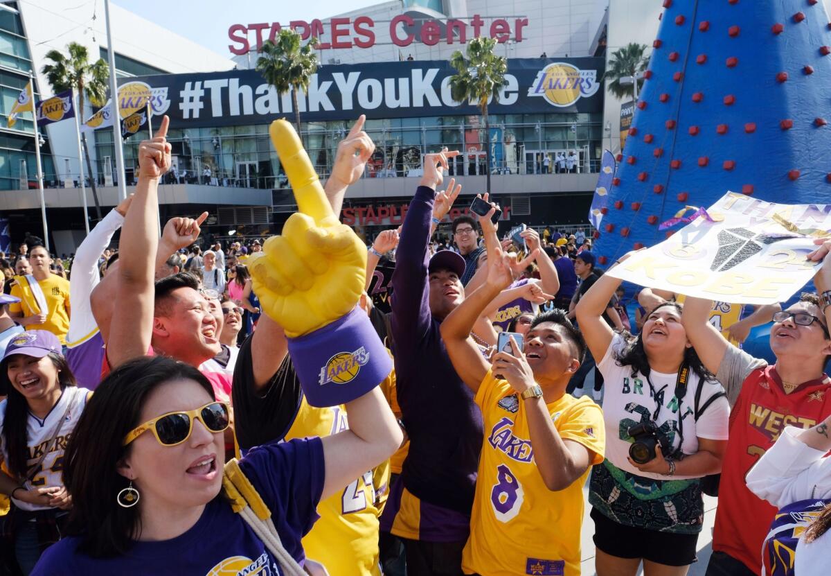 Fans celebrate outside Staples Center as Kobe Bryant prepares to play his last NBA basketball game, a contest against the Utah Jazz, in downtown Los Angeles Wednesday, April 13, 2016. Many of BryantGÇÜ+ä+¦s fans - even some of the adults - have never known Los Angeles without him. ItGÇÜ+ä+¦s a feeling theyGÇÜ+ä+¦re about to have to get used to as fans celebrate his final night as a Laker.