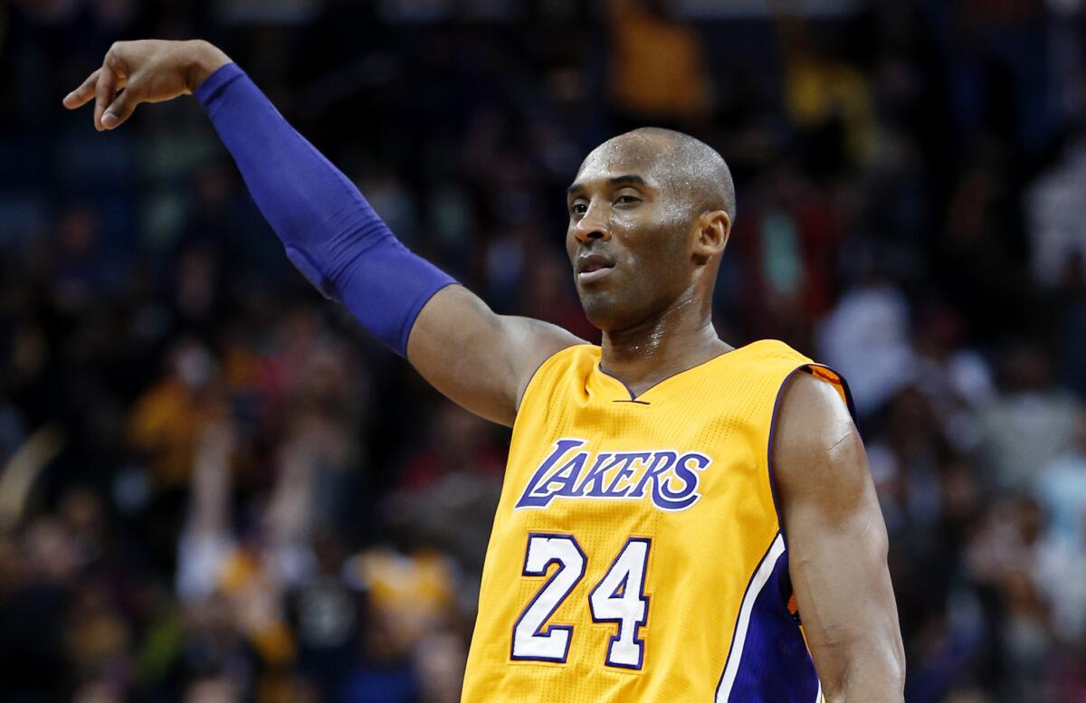 Los Angeles Lakers forward Kobe Bryant reacts after sinking a 3-point shot late in the second half against the New Orleans Pelicans on Thursday.