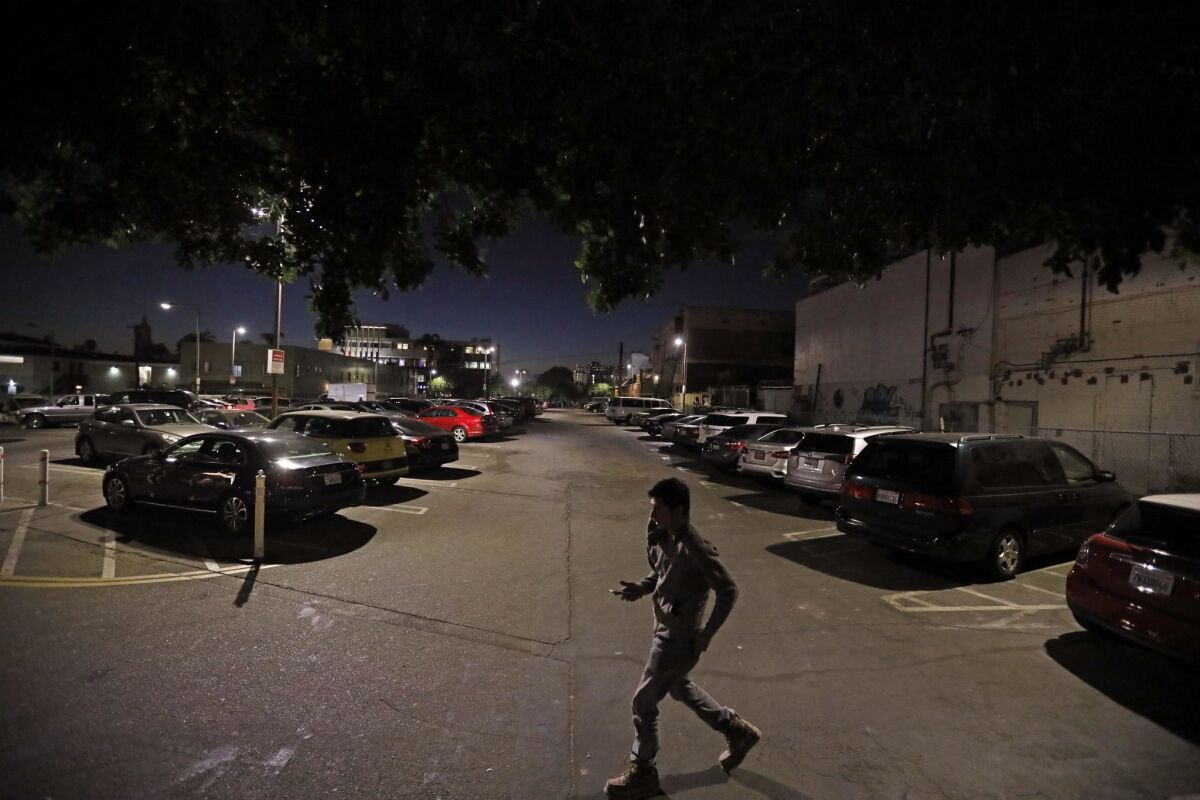 A man exits the parking lot at 1637 North Wilcox Avenue in Hollywood on January 31, 2018. 