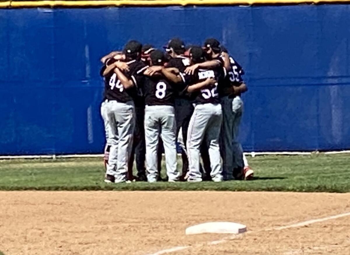 Reseda Cleveland players gathering before their 4-2 win over ECR in a West Valley League baseball opener.