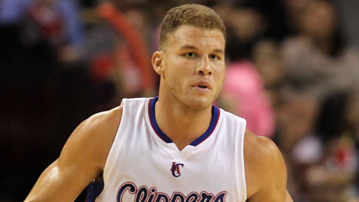 Clippers forward Blake Griffin takes part in the team's 104-93 preseason loss to the Denver Nuggets on Saturday.