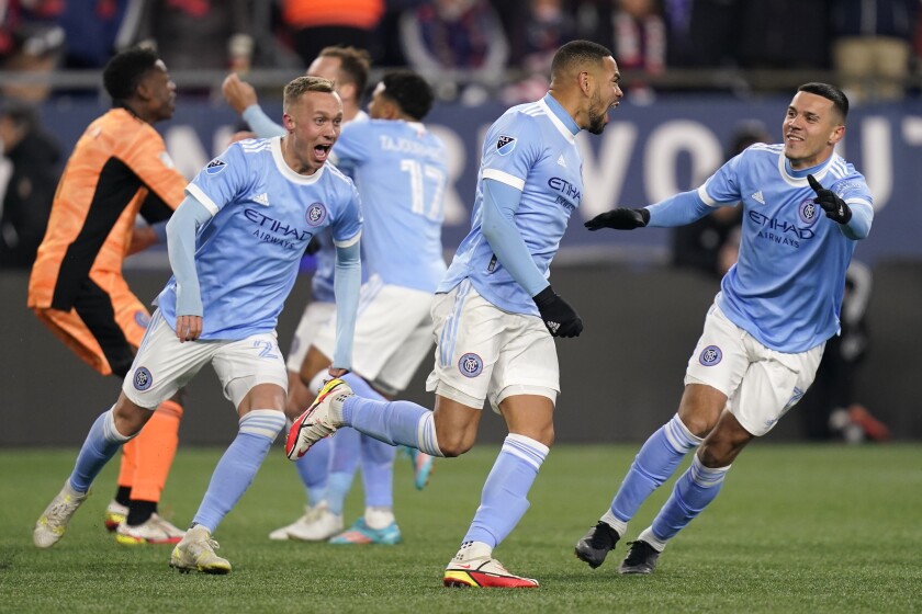New York City FC players celebrate after defeating the New England Revolution in an MLS playoff soccer match Tuesday, Nov. 30, 2021, in Foxborough, Mass. (AP Photo/Charles Krupa)