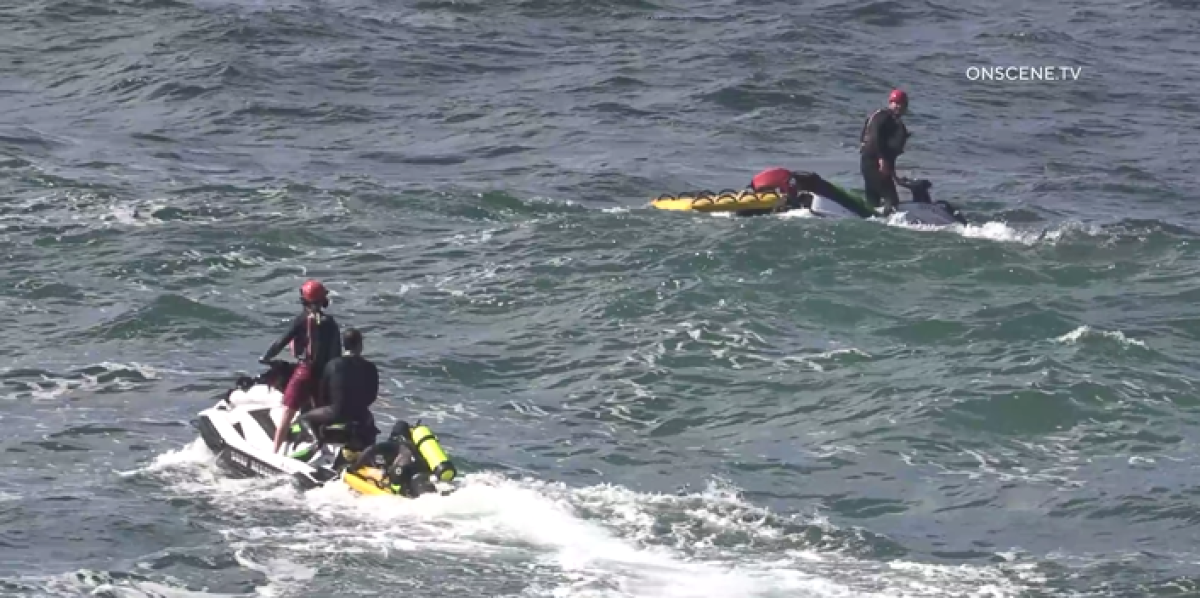 San Diego lifeguards search the ocean off La Jolla on March 10 after a body reportedly was swept away. 