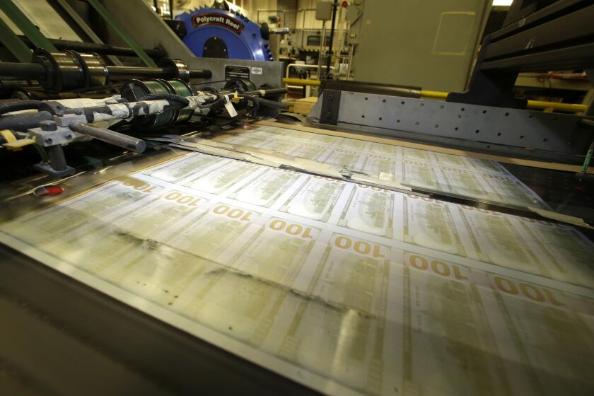 FILE - Sheets of uncut $100 run through a printing press at the Bureau of Engraving and Printing Western Currency Facility in Fort Worth, Texas, on Sept. 24, 2013. Retirement can loom like a dark cloud for small-business owners. Many invest blood, sweat and tears — and every penny — into building their business but never set cash aside for the future. A huge number of entrepreneurs have reported putting aside no retirement savings at all. For some, selling the business is their only retirement plan. (AP Photo/LM Otero, File)