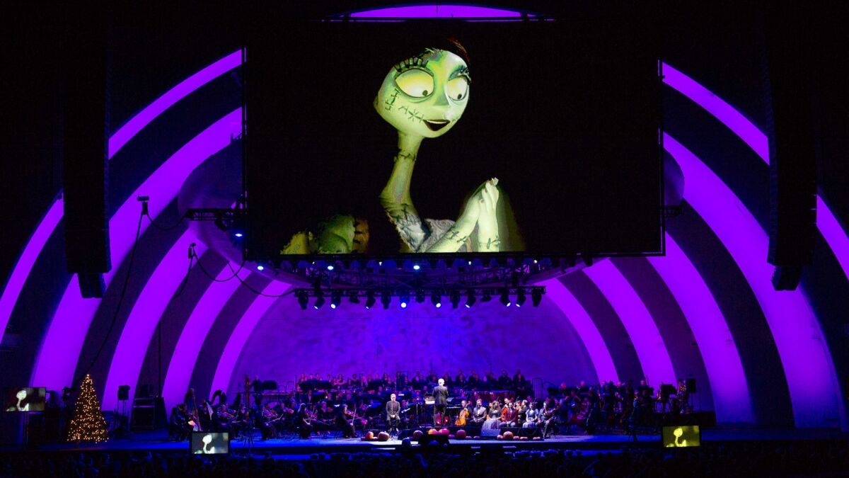 Screens show the movie "Nightmare Before Christmas" during Danny Elfman's "Nightmare Before Christmas" concert at the Hollywood Bowl in 2015.