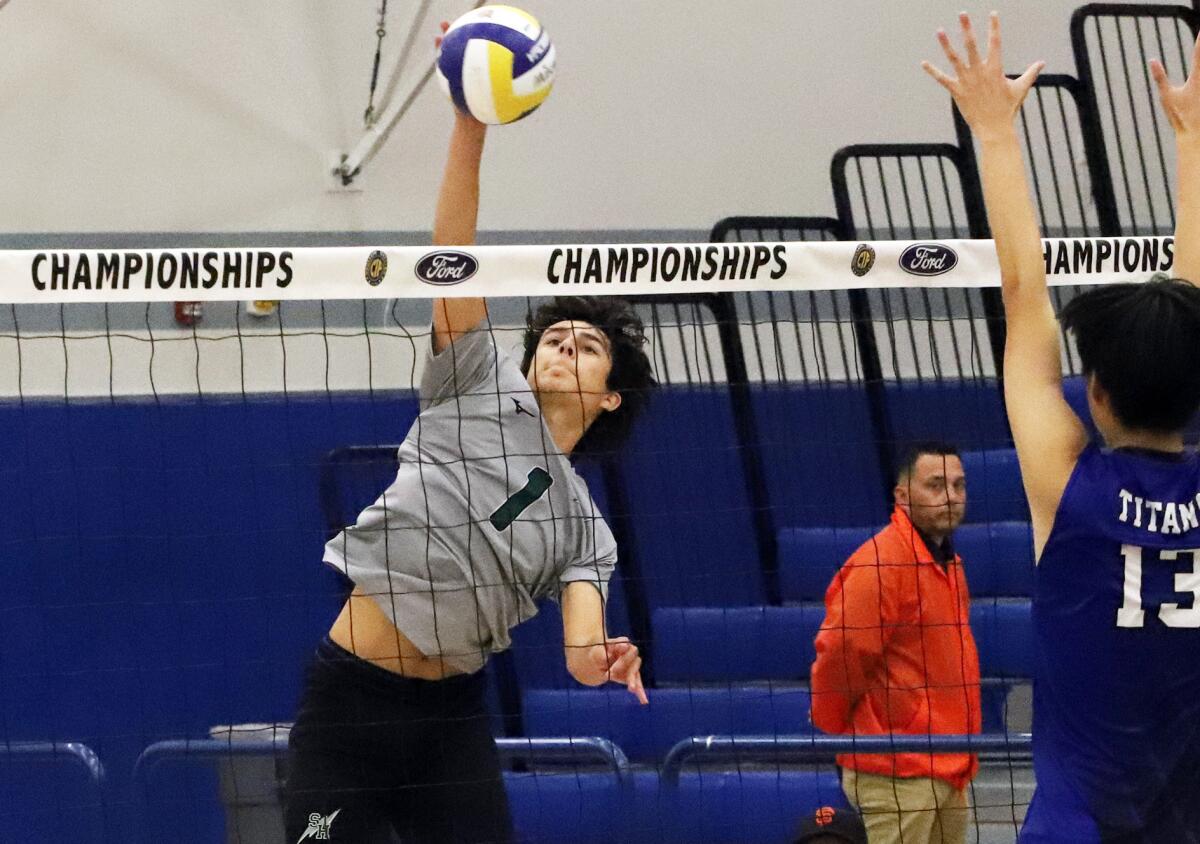 Sage Hill's Connor Gapp (1) spikes past San Marino's Jeffrey Li (13) in the CIF Southern Section Division 5 final.