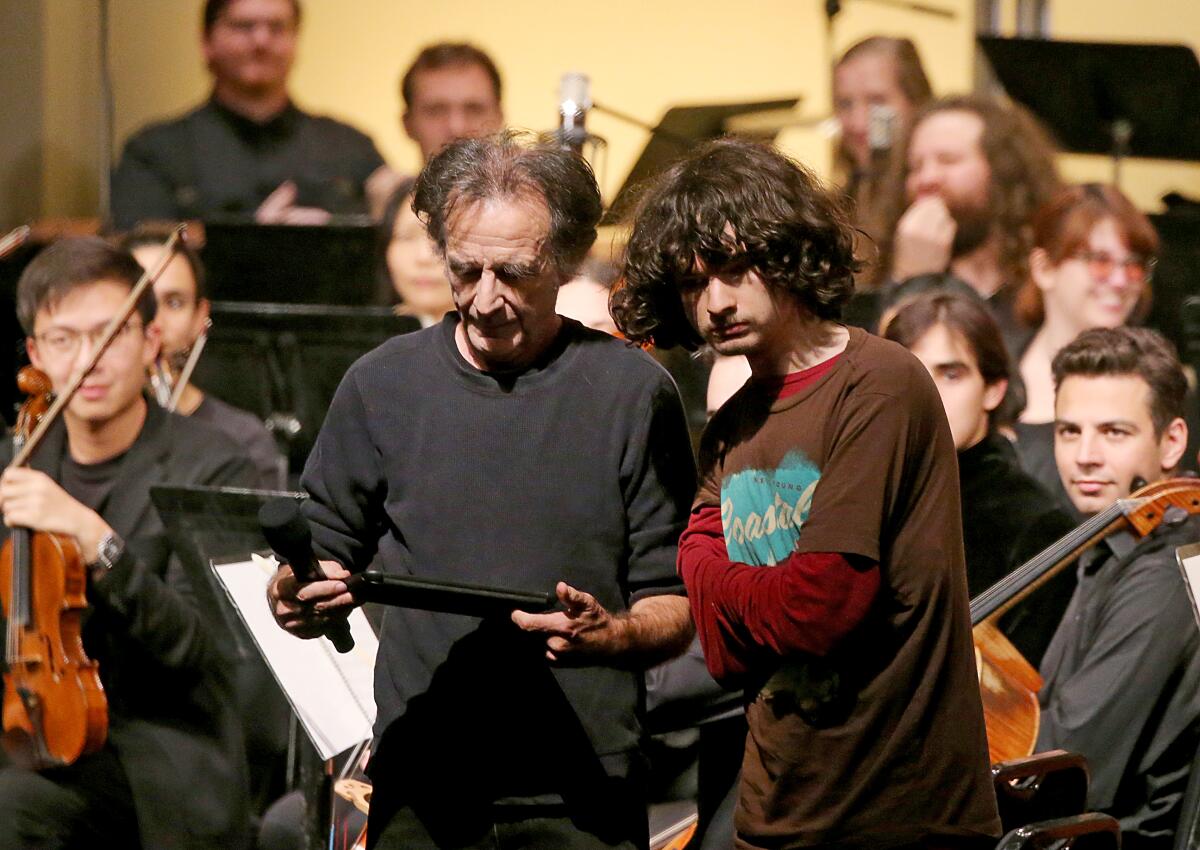 Musicians and composers onstage at a performance of a symphony
