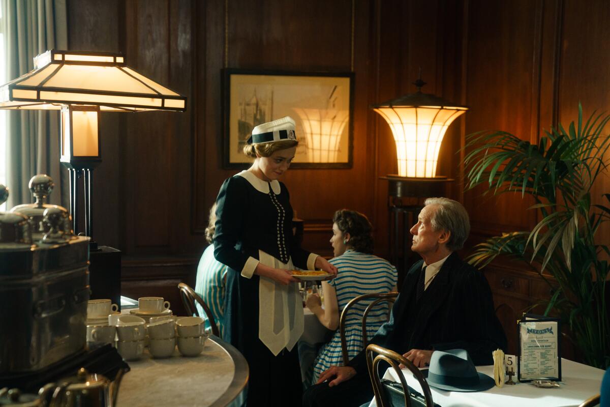 A man talks with a waitress in a cafe in a scene from "Living."