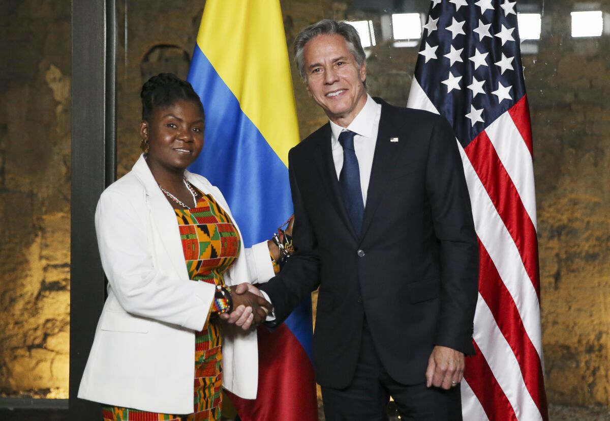 Colombia's Vice President Francia Marquez shakes hands with U.S. Secretary of State Antony Blinken during their visit to Fragmentos Museum, Monday, Oct. 3, 2022, in Bogota, Colombia. (Luisa Gonzalez/Pool via AP)