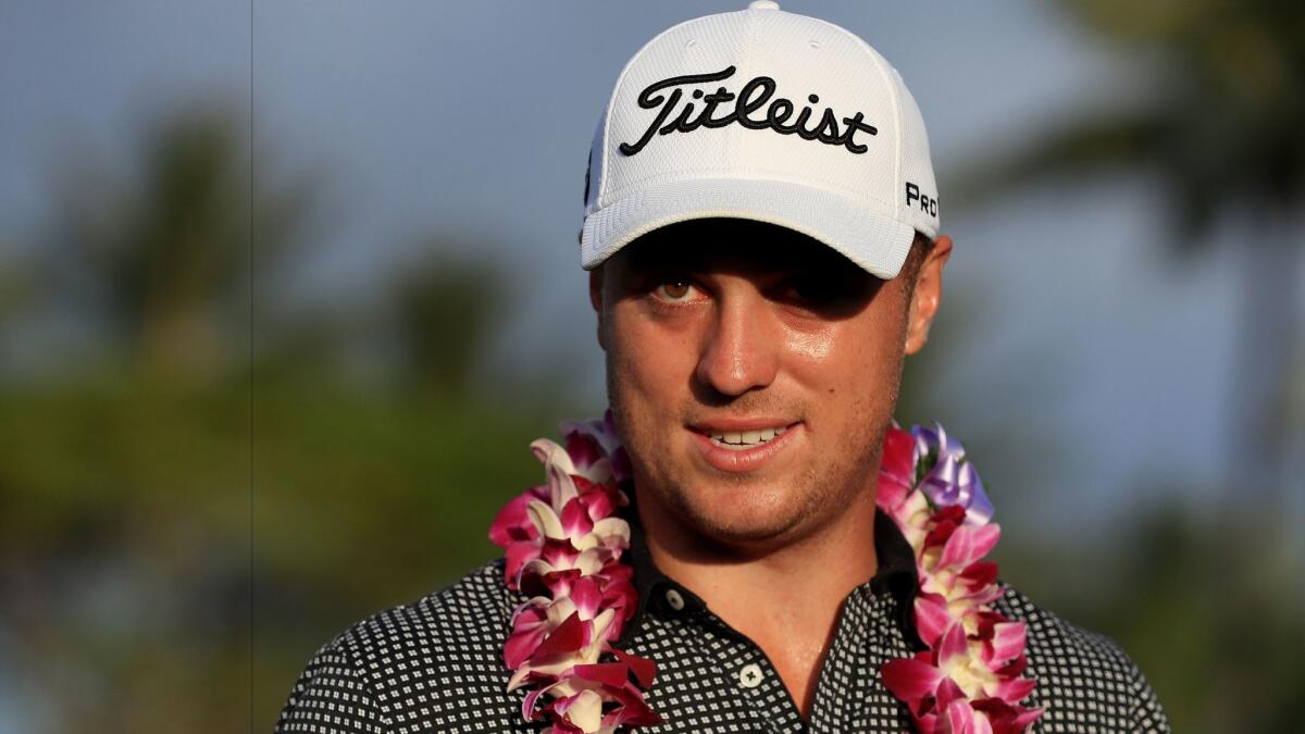 Justin Thomas waits for the awards ceremony after winning the Sony Open with a PGA Tour-record score of 253.