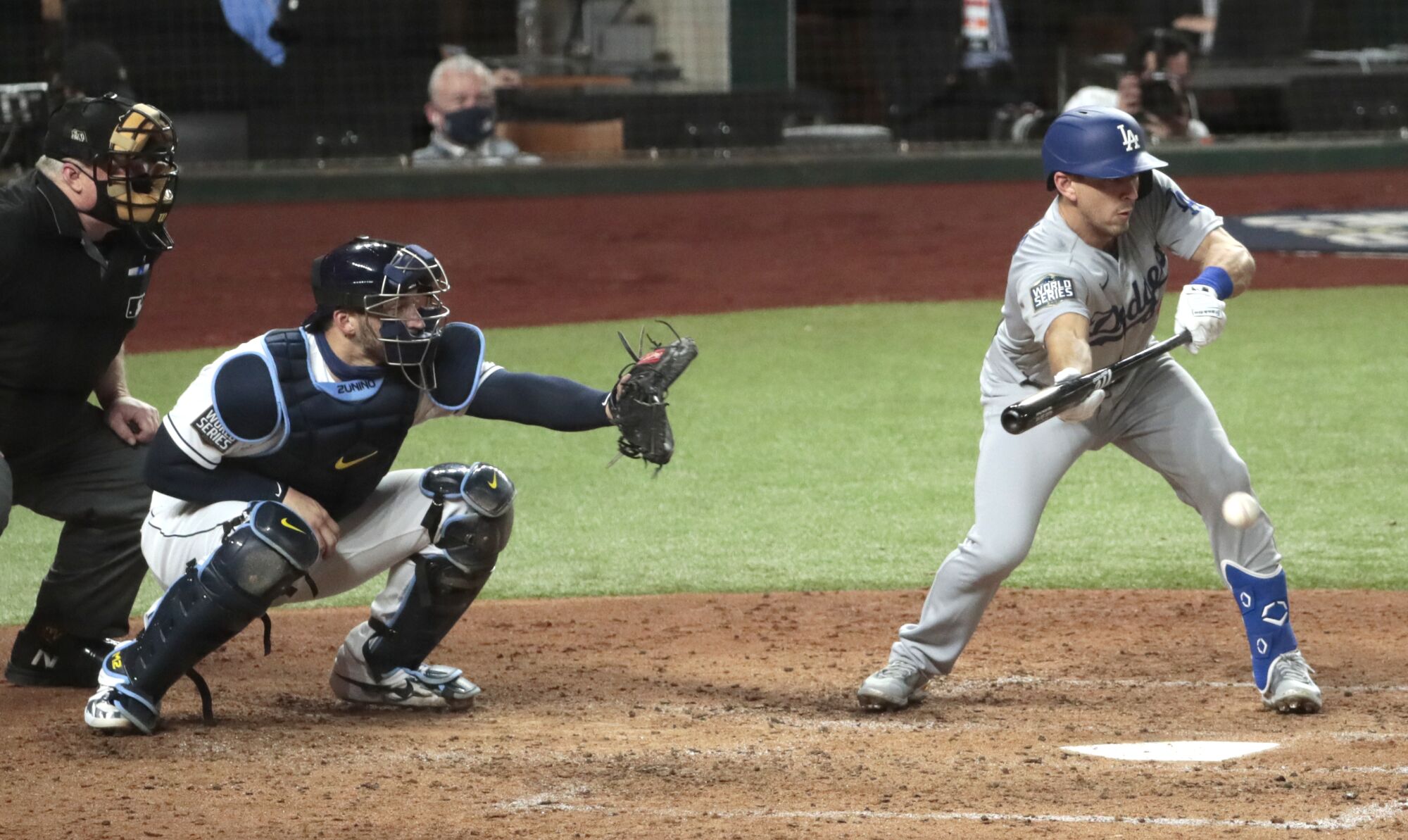 Dodgers catcher Austin Barnes lays down a sacrifice bunt to drive in a run during the fourth inning.