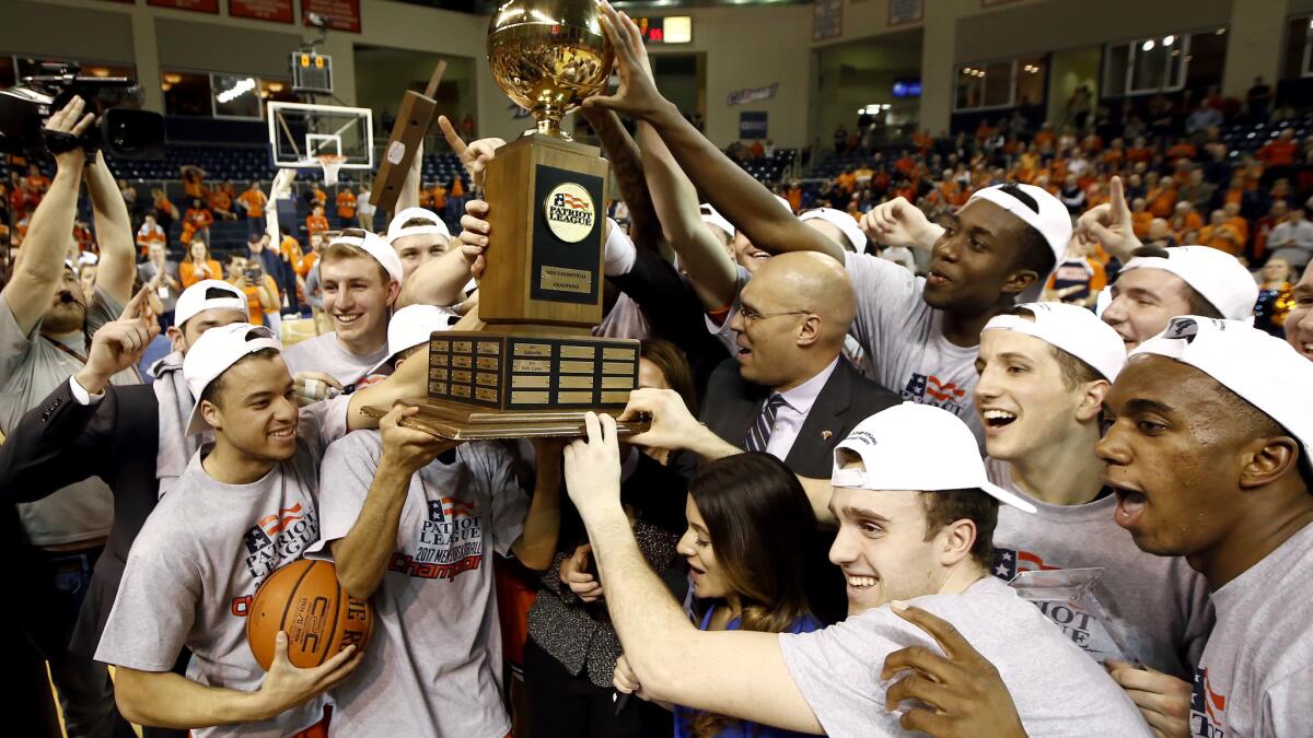Bucknell players and coaches celebrate after defeating Lehigh in the Patriot League tournament championship game on Wednesday night.